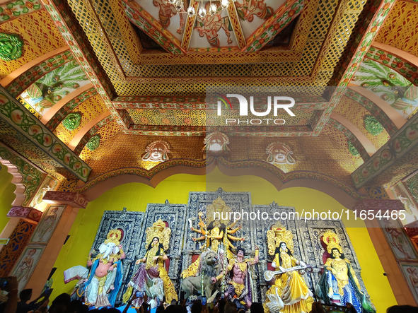 People visit a temporary platform called a pandal during the Hindu religious festival Durga Puja in Kolkata, India, on October 10, 2024. 