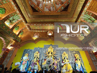 People visit a temporary platform called a pandal during the Hindu religious festival Durga Puja in Kolkata, India, on October 10, 2024. (