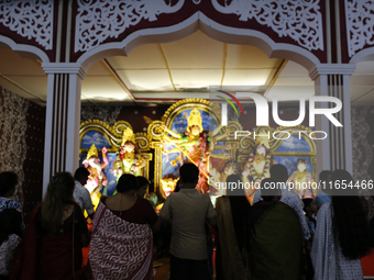 Hindu devotees visit a puja mandap during the Durga Puja festival in Dhaka, Bangladesh, on October 10, 2024. (