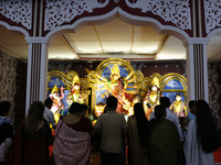 Hindu devotees visit a puja mandap during the Durga Puja festival in Dhaka, Bangladesh, on October 10, 2024. (