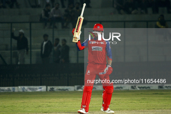 Ben Dunk of India Capitals raises his bat after scoring 50 during the Legends League Cricket T20 match between Manipal Tigers and India Capi...