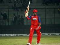 Ben Dunk of India Capitals raises his bat after scoring 50 during the Legends League Cricket T20 match between Manipal Tigers and India Capi...