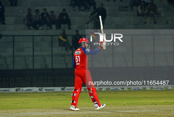 Ben Dunk of India Capitals raises his bat after scoring 50 during the Legends League Cricket T20 match between Manipal Tigers and India Capi...