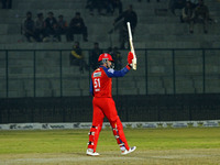 Ben Dunk of India Capitals raises his bat after scoring 50 during the Legends League Cricket T20 match between Manipal Tigers and India Capi...