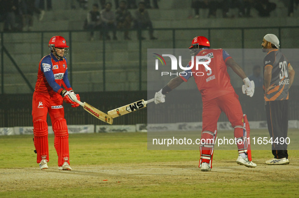 Ben Dunk (left) and Ashley Nurse (right) of India Capitals react during the Legends League Cricket T20 match between Manipal Tigers and Indi...