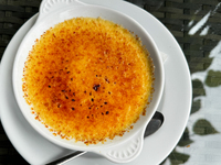 A creme brulee dessert is seen at a restaurant table in this illustration photo taken in Krakow, Poland on October 10, 2024. (