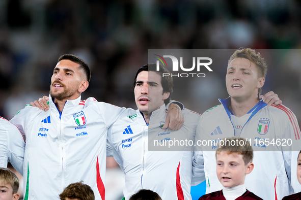 Lorenzo Pellegrini of Italy sings national anthem with Matteo Retegui and Sandro Tonali during the UEFA Nations League 2024/25 League A Grou...