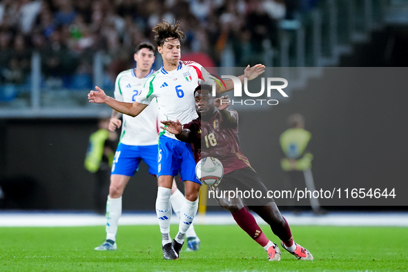 Samuele Ricci of Italy and Orel Mangala of Belgium compete for the ball during the UEFA Nations League 2024/25 League A Group A2 match betwe...