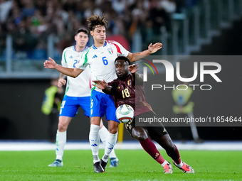 Samuele Ricci of Italy and Orel Mangala of Belgium compete for the ball during the UEFA Nations League 2024/25 League A Group A2 match betwe...