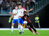 Samuele Ricci of Italy and Orel Mangala of Belgium compete for the ball during the UEFA Nations League 2024/25 League A Group A2 match betwe...