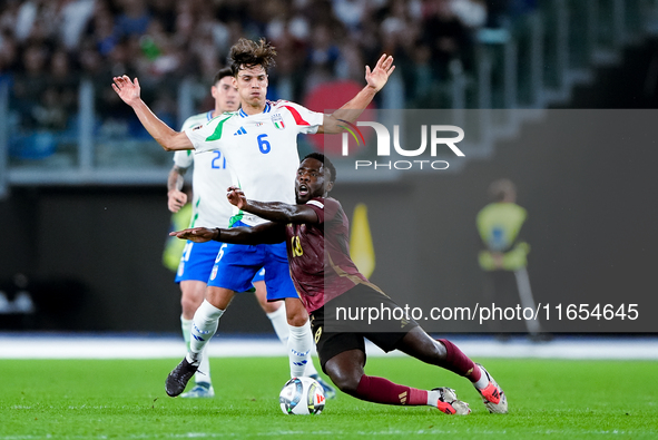 Samuele Ricci of Italy and Orel Mangala of Belgium compete for the ball during the UEFA Nations League 2024/25 League A Group A2 match betwe...