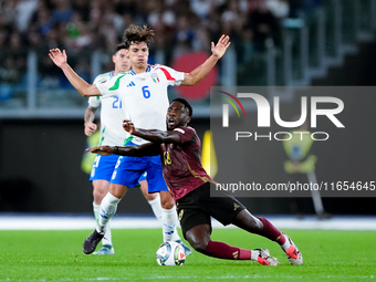 Samuele Ricci of Italy and Orel Mangala of Belgium compete for the ball during the UEFA Nations League 2024/25 League A Group A2 match betwe...