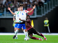 Samuele Ricci of Italy and Orel Mangala of Belgium compete for the ball during the UEFA Nations League 2024/25 League A Group A2 match betwe...