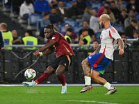 Jeremy Doku (BEL) and Federico Dimarco (ITA) participate in the UEFA National League Matchday 3 match between Italy and Belgium at the Olymp...