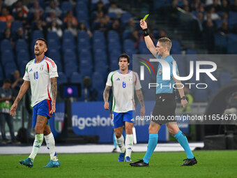 Lorenzo Pellegrini (ITA) and Referee Espen Eskas (NOR) are present during the UEFA National League Matchday 3 match between Italy and Belgiu...