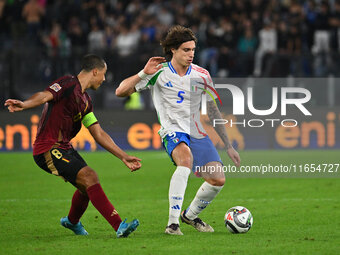 Youri Tielemans (BEL) and Riccardo Calafiori (ITA) are in action during the UEFA Nations League Matchday 3 match between Italy and Belgium a...