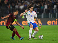 Youri Tielemans (BEL) and Riccardo Calafiori (ITA) are in action during the UEFA Nations League Matchday 3 match between Italy and Belgium a...