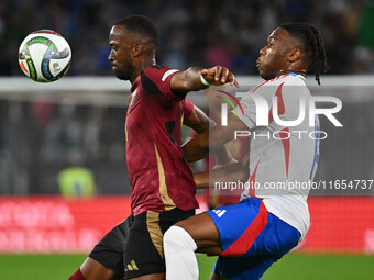 Dodi Lukebakio (BEL) and Destiny Udogie (ITA) are in action during the UEFA Nations League Matchday 3 match between Italy and Belgium at the...