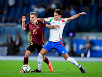 Leonardo Trossard of Belgium and Samuele Ricci of Italy compete for the ball during the UEFA Nations League 2024/25 League A Group A2 match...