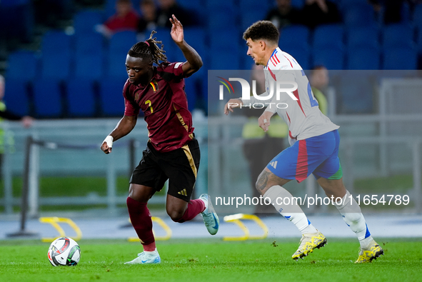 Jeremy Doku of Belgium and Giovanni Di Lorenzo of Italy compete for the ball during the UEFA Nations League 2024/25 League A Group A2 match...