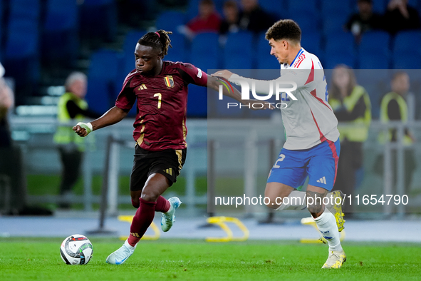 Jeremy Doku of Belgium and Giovanni Di Lorenzo of Italy compete for the ball during the UEFA Nations League 2024/25 League A Group A2 match...