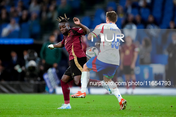 Jeremy Doku of Belgium and Davide Frattesi of Italy compete for the ball during the UEFA Nations League 2024/25 League A Group A2 match betw...