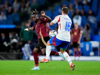 Jeremy Doku of Belgium and Davide Frattesi of Italy compete for the ball during the UEFA Nations League 2024/25 League A Group A2 match betw...