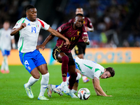 Dodi Lukebakio of Belgium and Destiny Udogie of Italy compete for the ball during the UEFA Nations League 2024/25 League A Group A2 match be...