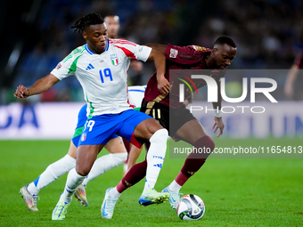 Dodi Lukebakio of Belgium and Destiny Udogie of Italy compete for the ball during the UEFA Nations League 2024/25 League A Group A2 match be...