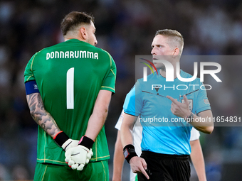 Gianluigi Donnarumma of Italy protests with the referee Espen Eskas for a penalty kick during the UEFA Nations League 2024/25 League A Group...