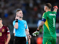 Gianluigi Donnarumma of Italy protests with the referee Espen Eskas for a penalty kick during the UEFA Nations League 2024/25 League A Group...