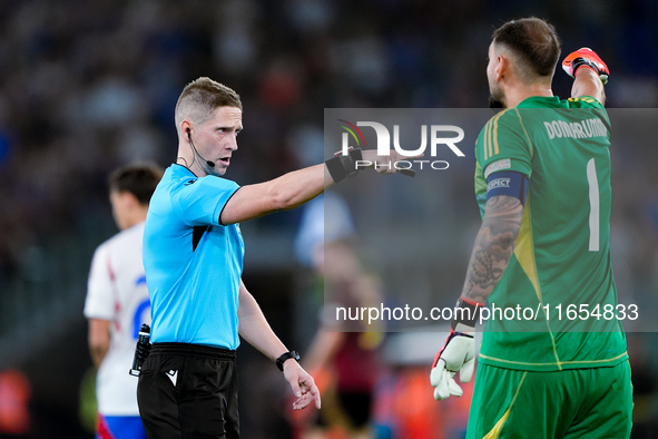 Gianluigi Donnarumma of Italy protests with the referee Espen Eskas for a penalty kick during the UEFA Nations League 2024/25 League A Group...