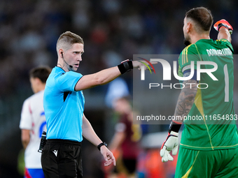 Gianluigi Donnarumma of Italy protests with the referee Espen Eskas for a penalty kick during the UEFA Nations League 2024/25 League A Group...