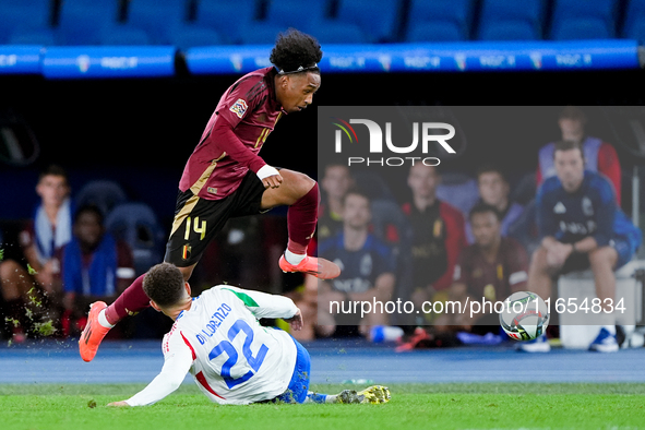 Malick Fofana of Belgium and Giovanni Di Lorenzo of Italy compete for the ball during the UEFA Nations League 2024/25 League A Group A2 matc...