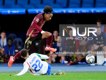 Malick Fofana of Belgium and Giovanni Di Lorenzo of Italy compete for the ball during the UEFA Nations League 2024/25 League A Group A2 matc...