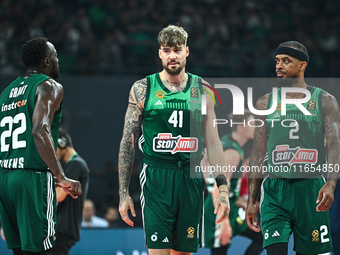 Juancho Hernangomez, Lorenzo Brown, and Jerian Grant of Panathinaikos AKTOR Athens play during the Euroleague, Round 2 match between Panathi...