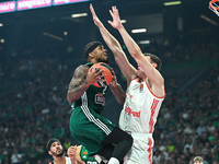 Lorenzo Brown of Panathinaikos AKTOR Athens competes with Johannes Voigtmann of FC Bayern Munich during the Euroleague, Round 2 match betwee...