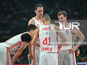 Andreas Obst, Johannes Voigtmann, Yam Madar, and Vladimir Lucic of FC Bayern Munich play during the Euroleague, Round 2 match between Panath...