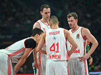 Andreas Obst, Johannes Voigtmann, Yam Madar, and Vladimir Lucic of FC Bayern Munich play during the Euroleague, Round 2 match between Panath...