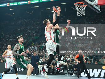 Andreas Obst of FC Bayern Munich competes with Marius Grigonis of Panathinaikos AKTOR Athens during the Euroleague, Round 2 match between Pa...