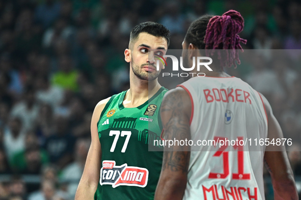 Omer Yurtseven of Panathinaikos AKTOR Athens and Devin Booker of FC Bayern Munich participate in the Euroleague, Round 2 match between Panat...