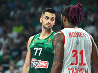 Omer Yurtseven of Panathinaikos AKTOR Athens and Devin Booker of FC Bayern Munich participate in the Euroleague, Round 2 match between Panat...