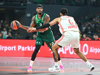 Lorenzo Brown of Panathinaikos AKTOR Athens competes with Nick Weiler-Babb of FC Bayern Munich during the Euroleague, Round 2 match between...