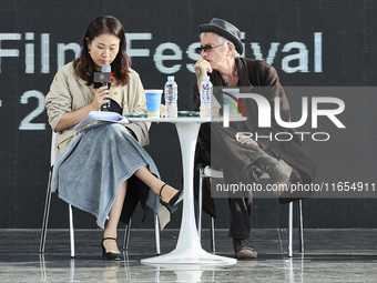 Actor Ryu Jun Yeol and Director Leos Carax attend their Open Talk stage at Cinema Center in Busan, South Korea, on October 9, 2024. (