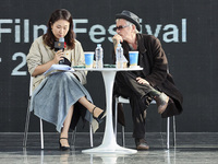 Actor Ryu Jun Yeol and Director Leos Carax attend their Open Talk stage at Cinema Center in Busan, South Korea, on October 9, 2024. (