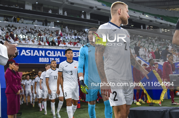 Players of Kyrgyzstan and Qatar arrive on the pitch before the FIFA World Cup 2026 AFC Asian Qualifiers 3rd round group A match between Qata...