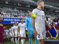 Players of Kyrgyzstan and Qatar arrive on the pitch before the FIFA World Cup 2026 AFC Asian Qualifiers 3rd round group A match between Qata...