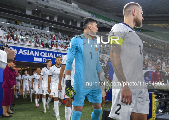 Players of Kyrgyzstan and Qatar arrive on the pitch before the FIFA World Cup 2026 AFC Asian Qualifiers 3rd round group A match between Qata...