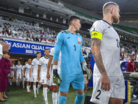 Players of Kyrgyzstan and Qatar arrive on the pitch before the FIFA World Cup 2026 AFC Asian Qualifiers 3rd round group A match between Qata...