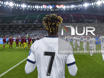 Players of Kyrgyzstan and Qatar arrive on the pitch before the FIFA World Cup 2026 AFC Asian Qualifiers 3rd round group A match between Qata...